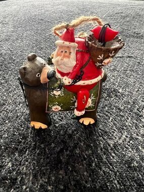 Santa Claus Riding a Bear Christmas Ornament